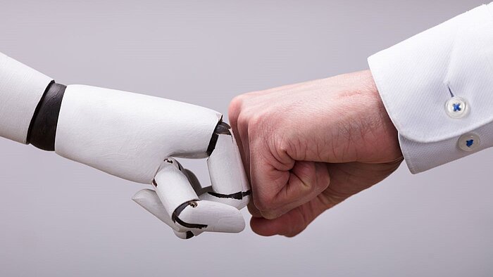 Fist bump between a human and a robot